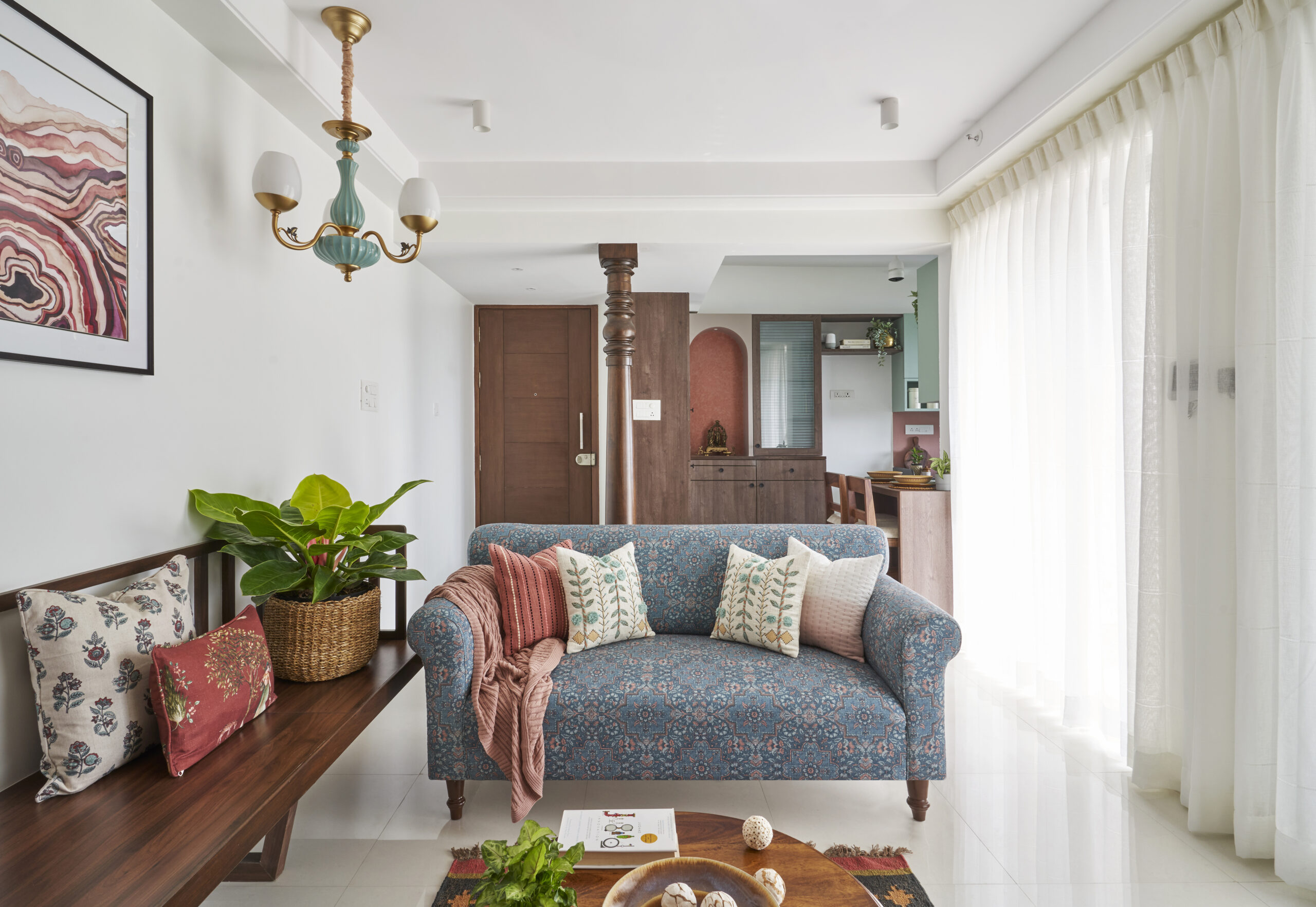 A hint of traditional elements with an earthy palette for this 730 Sqft Pune apartment, designed by INI Studio